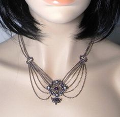 A wonderful fine 835 European silver necklace circa 1920 set with cultured pearls and Natural Amethyst Cabochons. This very feminine necklace is designed to drape beautifully down the decolletage. The pendant at the front including the drop measures approximately 1 9/16" and is 1 9/16" side to side (40mm x 39mm). It is set with four cultured pearls each approximately 3.5mm in diameter. The top amethyst cabochon measures 7.5mm by 5.5mm approximately and the one at the bottom measures approximatel Antique Pearl Pendant Necklace For Formal Occasions, Victorian Hallmarked Jewelry For Opera, Elegant Evening Cabochon Necklaces, Antique Pendant Jewelry For Opera, Antique Silver Pearl Necklace For Formal Occasions, Antique Round Pearl Necklace For Wedding, Antique Pearl Necklace For Formal Occasions, Victorian Jewelry With Historical Design For Evening, Victorian Pearl Necklace For Formal Occasions