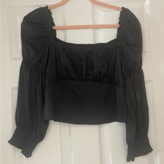 Cropped Blouse With Square Neckline And Puff Sleeves. Smocking At Back. Size 8 (Fits Closer To A Small). Brand H&M. Nwt. Black Padded Blouse With Lantern Sleeves, Black Padded Lantern Sleeve Blouse, Cropped Blouse With Gathered Sleeves For Fall, Chic Black Peasant Top For Spring, Black Ruffle Square Neck Top, Fitted Black Peasant Top For Spring, Party Tops With Smocked Bodice And Puff Sleeves, Fall Black Blouse With Smocked Bodice, Black Tops With Smocked Bodice And Square Neck