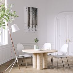 a white room with a table and chairs