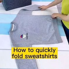 a woman is making a t - shirt with the words how to quickly fold sweatshirts