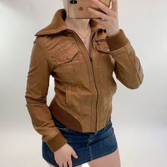 00's brown leather jacket  In good condition although a few minor scuffs A size S Modelled on a size 8 Measurements: Pit to pit: 19 inches Length: 23 inches Shoulder length: 15 inches 3 pockets outside Genuine leather Message with any questions  -Lucy at RARIFY   (199R) Casual Brown Leather Jacket With Long Sleeves, Brown Leather Biker Jacket With Pockets, Brown Faux Leather Biker Jacket For Winter, Casual Vintage Brown Biker Jacket For Fall, Casual Brown Leather Jacket For Winter, Brown Faux Leather Outerwear For Winter, Brown Faux Leather Winter Outerwear, Fitted Distressed Brown Leather Biker Jacket, Fitted Brown Biker Jacket With Pockets