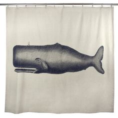 a black and white photo of a whale on a shower curtain hanging from a metal rod