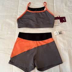 2 Piece. Never Worn. Small Adult. Orange Athleisure Activewear With Built-in Shorts, Sporty Stretch Orange Athletic Shorts, Orange Stretch Training Shorts, Orange Activewear With Built-in Shorts For Training, Orange Moisture-wicking Shorts Activewear, Orange Moisture-wicking Athletic Shorts For Training, Orange Moisture-wicking Activewear Shorts, Orange Moisture-wicking Short Activewear, Summer Orange Yoga Activewear