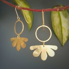 Brass Drop Earrings With Flower Charm, Gold Brass Earrings With Flower Charm, Gold Teardrop Flower Charm Earrings, Gold Teardrop Flower Earrings With Charm, Nickel-free Brass Flower-shaped Earrings, Silver Brass Flower-shaped Earrings, Gold Brass Flower-shaped Earrings, Brass Flower Charm Earrings, Gold Dangle Hoop Earrings With Flower Charm