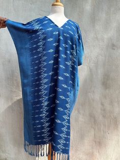 You will look fabulous in this truly unique hand made kaftan from hand woven (with hand woven pattern!) and hand dyed thread. The kaftan feels as good as it looks with soft and graceful drape. Pefect for evening wear, events and out and about it is made with care and long lasting quality. Blue Ikat Print Kaftan For Summer, Summer Blue Ikat Print Kaftan, Bohemian Blue Kimono With Natural Dye, Traditional Handmade Kaftan With Kimono Sleeves, Blue Bohemian Kimono With Natural Dye, Indigo Tunic Kaftan, Blue Bohemian Kurta For Festival, Blue Bohemian Maxi Kurta, Blue Bohemian Dress With Woven Motifs