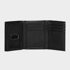 Carry your cards and money in comfortable style with this Extra-Capacity Trifold Wallet from Goodfellow & Co™. This tri-fold wallet features multiple card slots, ID pocket and a bill compartment, while the tri-fold design lends it a non-bulky feel, making it easier to slip in the front or rear pockets of your trousers. Best of all, it features RFID blocking that helps prevent your cards and IDs from digital theft. Showcasing a faux-leather finish in black, it's sure to bring classic style to you Black Trifold Wallet With Interior Card Slots, Black Trifold Wallet With Coin Pocket, Black Trifold Card Holder, Black Trifold Wallet For Travel, Black Trifold Travel Wallet, Trifold Wallet With Card Slots For Travel, Travel Trifold Wallet With Card Slots, Trifold Wallet With Card Slots, Leather Finish