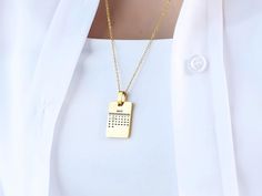 Celebrate the chapters of your love story with an accessory that's as unique as your bond - our Stainless Steel Personalized Calendar Necklace. This elegant piece is more than just jewelry; it's a wearable memento that encapsulates the heartbeats of your most treasured moments. Whether it's the warmth of golden sunsets or the cool reflection of moonlit nights, choose from our rich gold or classic silver finishes to match the essence of your relationship. Made from high-quality stainless steel, t Valentine's Day Anniversary Necklace With Message Card, Valentine's Day Anniversary Jewelry With Message Card, Elegant Valentine's Day Necklace With Message Card, Elegant Necklace With Message Card For Anniversary, Elegant Necklaces For Anniversary Gift With Message Card, Gold Necklace For Valentine's Day With Message Card, Gold Jewelry With Message Card For Birthday, Gold Jewelry With Message Card For Mother's Day, Calendar Necklace