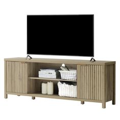 an entertainment center with a flat screen tv mounted on it's side and shelves