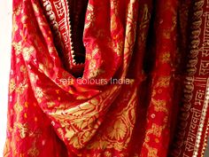 Express shipping! A very beautiful red colour Sada Saubhagyawati Bhava rich Banarsi Ghatchola silk golden zari woven dupatta. This dupatta also has Bandhani hand tie dye design. It can be used for wedding dupatta, Odhani, with festival outfits, Lehenga dupatta, it is a multipurpose dupatta which goes with most of the things and occassions. It can also be used to gift to someone. This is a zari woven dupatta with full length there is no print on it. Dimension: Length: 2.5 meter Width: 1.04 meter Jamawar Dupatta With Gota Work, Traditional Jamawar Dupatta With Gota Work, Jamawar Dupatta With Gota Work In Traditional Drape, Bollywood Style Jamawar Dupatta With Gota Work, Red Jamawar Sharara With Zari Work, Festive Jamawar Dupatta With Gota Work, Traditional Red Salwar Kameez With Sheer Dupatta, Red Anarkali Set With Pallu In Traditional Drape, Traditional Red Anarkali Set With Sheer Dupatta