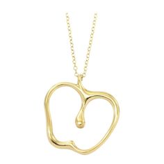 TIFFANY & Co. Elsa Peretti 18K Gold Apple Pendant Necklace Metal: 18K yellow gold Weight: 3.60 grams Chain: 16" Pendant: 16.10mm wide x 17.20mm high Hallmark: "T&CO. 750 PERETTI" on chain tag, "750" on chain clasp Limited edition, no longer available for sale in Tiffany stores Authenticity Guaranteed Fine Jewelry Yellow Gold Pear-shaped Necklace, Fine Jewelry Yellow Gold Pear Necklace, Yellow Gold Plated Necklace As Gift, Yellow Gold Plated Necklace For Gift, Yellow Gold Plated Necklace With Shiny Finish, Luxury Gold Pear-shaped Necklace, Fine Jewelry Yellow Gold Necklaces With Shiny Finish, 14k Yellow Gold Pear Necklace, 14k Yellow Gold Pear Shaped Necklace