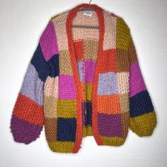 Frnch Paris Anthro Maelia Rainbow Chunky Knit Checkered Cardigan Sweater O/S Excellent Pre Owned Condition Puff Sleeves, Very Soft, Patchwork, Hand Knit, Oversize >> Style M522-82at >> 100% Acrylic >> Size One Size >> Bust 38“ >> Length 27“ >> Sleeve 23“ All Measurements Are Approximate. Please Check The Measurements, Vintage And Pre Owned Items Vary In Size. I Identify All Known Flaws, Please Note The Pictures As Additional Description To The Condition. I Ship Within 24 Hours, Except On Sunday. Crochet Colorful Cardigan, Multicolor Soft Knit Cardigan For Fall, Fall Multicolor Soft Knit Cardigan, Multicolor Winter Cardigan For Layering, Winter Multicolor Cardigan For Layering, Fall Patchwork Sweater One Size, Multicolor Knitted Outerwear For Layering, One-size Patchwork Sweater For Fall, Multicolor Wool Long Sleeve Cardigan