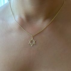 This meaningful pendant necklace is the universal symbol of the Jewish star, known as the Star of David. The necklace is composed of 14K solid gold and beautifully complemented by a durable 14K solid gold rope style chain which is finished with a lobster claw clasp. ﻿NOTE: This item can be customized for other length options. Kindly email us for pricing of shorter or longer length options. Star of David Dimensions: approximately 13mm (w) x 20mm (h) including the bail Chain Thickness: 1.15mm Meta Jewish Star, Star Of David Pendant, Solid Gold Necklace, Rose Gift, Braided Rope, Fine Jewelry Designers, Star Of David, Gold Star, Link Necklace