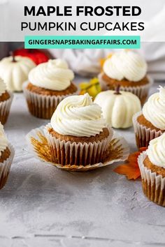 maple frosted pumpkin cupcakes with white frosting and leaves on the side