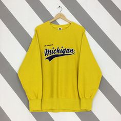 Vintage University Of Michigan Yellow Sweatshirt XLarge University Of Michigan Spell Out Crewneck Michigan Wolverines Ncaa Sweater Size XL Good Used Condition. No holes and stains. *Color may be slightly different from the original color due to lightning and background. Size (On Tag) : Size XL *To make sure if it FITS YOU, refer at the exact measurements. Size Measurement (All measurements were taken lying flat) : Width [armpit to armpit] : 24 inches / 61 cm Length [shoulder to end of garment] : 28 inches / 71 cm Ship by Using Express Shipping, takes 3-5 business days to arrived. *Please leave your phone number on the note when purchased. REF : r02012024 - M45 Yellow Crew Neck Winter Tops, Yellow Crew Neck Top For Winter, Collegiate Winter Tops With Screen Print, Collegiate Style Winter Tops With Screen Print, Winter Collegiate Tops With Screen Print, Yellow Crew Neck Top With Letter Print, Retro Yellow Tops For College, Collegiate Yellow Crew Neck Top, Yellow Crew Neck Fan Apparel Top