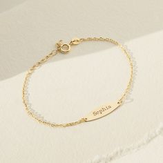 Celebrate your baby girls special day by gifting her with this beautiful thing engravable bracelet. A lightweight 5" bracelet crafted from 14k yellow gold that will fit safely and comfortably around your little girls small wrist. She will love to wear this toddlers engravable bracelet wherever she goes. Gift box included with. purchase. Elegant Personalized Bracelet For Mom, Elegant Personalized Bracelet As Gift For Mom, Elegant Personalized Name Bracelet As Gift For Mom, Elegant Personalized Bracelets As Gift For Mom, Everyday Adjustable Personalized Gold Bracelet, Personalized Adjustable Nameplate Gold Bracelet, Personalized Adjustable Gold Bracelet For Everyday, Dainty Personalized White Gold Bracelets, Dainty Personalized White Gold Name Bracelet