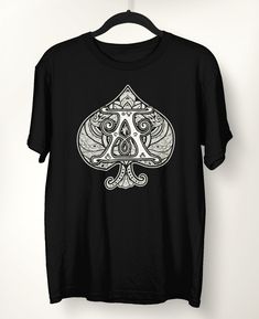 Ace of Spades Poker Card T-Shirt The Finer Details: * Original Bunkis1st design * 100% ring-spun cotton * Sport Grey is 90% ring-spun cotton, 10% polyester * Dark Heather is 65% polyester, 35% cotton * 4.5 oz/y² (153 g/m²) * Pre-shrunk * Shoulder-to-shoulder taping * Quarter-turned to avoid crease down the center www.etsy.com/shop/Bunkis1st Band Merch T-shirt With Crew Neck, Band Merch Crew Neck T-shirt As Gift, Band Merch Crew Neck T-shirt For Gift, Crew Neck T-shirt With Graphic Design For Gift, Cotton Tops With Graphic Design, Cotton Graphic Design Top As Gift, Band Merch Cotton T-shirt As Gift, Logo Print T-shirt With Crew Neck As A Gift, Logo Print T-shirt With Crew Neck For Gift