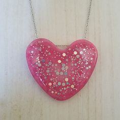 Large Pink Heart With Holographic Glitter On A Silver Tone Chain. Chain Measures Approx 18.5 Inches. Cute Heart Necklace For Valentine's Day Party, Silver Heart Necklace For Party, Cute Heart Necklace For Parties, Cute Heart Necklace For Party, Silver Heart Beads Necklace For Party, Trendy Silver Heart Necklace For Party, Handmade Heart Necklace For Party, Cute Silver Heart Charm Necklace, Silver Heart Charm Necklace For Party