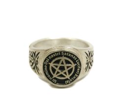 This ring was designed with the Satan's Invocation symbol. The beautiful pewter ring is a silver color and the background is blackened to bring out the fine detail of the design. Our rings are 100% Lead and nickel free pewter and made in the USA The top design part of the ring measures about 15 mm in diameter The ring band tapers from about 15mm to about 4.5mm at the bottom and is about 1.75mm thick Rings are available in sizes 7 to 14 Symbolic Silver Skull Ring, Silver Symbolic Skull Ring, Silver Adjustable Symbolic Skull Ring, Adjustable Black Symbolic Signet Ring, Silver Rings With Antique Finish, Silver Antique Finish Rings, Antique Finish Silver Metal Rings, Gothic Silver Engraved Ring, Silver Gothic Engraved Rings