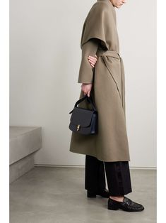 THE ROW Adia oversized belted cashmere coat Elegant Office Cape Outerwear, Elegant Cape Wool Coat For Work, Chic Cape Outerwear For Office, Chic Office Cape Outerwear, Chic Oversized Structured Wool Coat, Chic Evening Wool Coat With Lapel Collar, Modern Cape For Workwear In Fall, Modern Fall Cape For Workwear, Chic Oversized Outerwear For Evening