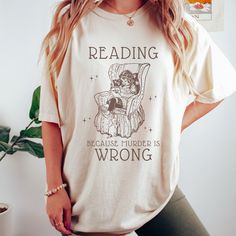 Get ready to be OBSESSED with your new reading shirt. It's the cutest and most trendy way to combine all those important trendy light academia and victorian aesthetic vibes! This is the perfect bookish shirt!  * Q U I C K * F A C T S * ✺  All shirts are UNISEX ✺  100%  ringspun cotton (fiber content may vary for different colors) ✺  Soft-washed, garment-dyed fabric brings extra coziness ✺  Wash and dry normally (on cool for best results) ✺  Sewn-in twill label * S I Z I N G * ✺ For an oversized fit, select two or three sizes up from your normal size ✺ Model is wearing size L  ✺ Sizing runs true to size ✺ Relaxed fit ✺ Most women find their typical size works best, since they are meant to fit a touch loose ✺ See Size guide and fit in images          * S H I P P I N G * T I M E S * ✺ Our ite Bookish Crew Neck Shirt With Text Print, Bookish Crew Neck Shirt With Letter Print, Bookish Relaxed Fit Graphic Print Top, Literary Style Short Sleeve Screen Print Tops, Crew Neck Shirt With Text Print, Screen Print Short Sleeve Tops, Bookish Crew Neck Shirt With Graphic Print, Relaxed Fit Graphic Print Shirt In Bookish Style, Relaxed Fit Graphic Print Shirt With Bookish Style