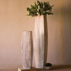 These vases are hollow, making them perfect to display our long-stemmed botanica or create an arrangement of your own! Small: 24in H, Large: 8in Dia x 37in H Finish: Distressed Natural Material: Wood Set of 2 Shop more Kalalou Concrete Creations, Wooden Vases, Tall Glass Vases, Vase Pottery, White Wash Finish, Wood Vase, Wooden Vase, Table Vase, Decor Pillows