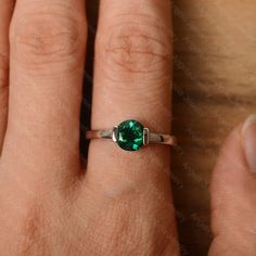 It is a lab emerald ring. The main stone is 7 mm*7 mm round cut.weight about 1.30 carats. The basic metal is sterling silver and plated with rhodium/14k white gold/14k rose gold/14k yellow gold You can also go to my shop Home for more elegant rings: https://www.etsy.com/shop/godjewelry?ref=hdr_shop_menu Customization is always welcome and please feel free to contact with me if you have any design ideas! Sterling Silver Emerald Ring With Bezel Setting, Solitaire Round Emerald Ring For Promise, Anniversary Emerald Ring, May Birthstone, Round Cut, Round Solitaire Emerald Promise Ring, Anniversary Emerald Ring For May Birthstone In Round Cut, Anniversary Emerald Ring For May Birthstone, Round Cut, Anniversary White Gold Emerald Ring With Bezel Setting, Silver Emerald Ring With Bezel Setting, Emerald Bezel Setting Birthstone Ring For May