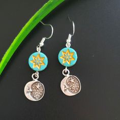 Beautiful Crescent Moon Celestial Earrings Dangle. Made With High Quality Antique Silver Charm, Turquoise Star Bead And Sterling Silver Hook Earrings. These Artisan-Made Earrings Perfectly Hang 1.5 Inches. Lightweight And Super Comfortable To Everyday Wear. All Jewelry Components Are Lead And Nickel Free! Blue Round Earrings With Moon Charm, Blue Moon-shaped Sterling Silver Earrings, Bohemian Blue Moon Shaped Earrings, Bohemian Blue Moon-shaped Earrings, Blue Dangle Earrings With Moon Charm, Silver Sun And Moon Design Earrings For Gift, Blue Sterling Silver Sun And Moon Jewelry, Blue Celestial Nickel-free Earrings, Silver Earrings With Sun And Moon Design As Gift