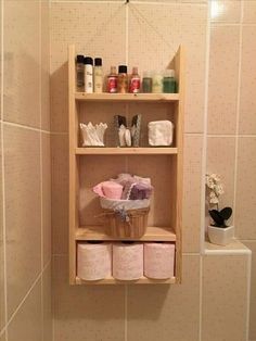 a shelf in a bathroom filled with personal care items