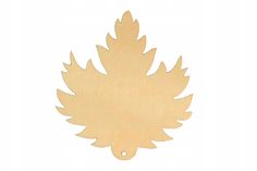 a wooden cutout of a leaf on a white background