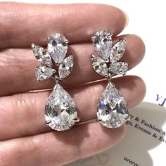 "Nature inspired woodland wedding leaves bridal earrings made of clear cubic zirconia in leaf vines motifs in tarnish-resistant silver rhodium white gold base. Earrings are about 1 1/8\" (3cm). View matching pieces or similar designs at https://etsy.me/2pBI3KY and https://etsy.me/2oMECSh View designs related to vines, branches, twigs or leaves at https://etsy.me/1E5j438 View all earrings at https://etsy.me/1f8VFT4 Our best offer in bridal & everyday collections only at yjdesign.com.au" Pear-shaped Diamond White Cluster Earrings For Wedding, Wedding Teardrop Cluster Earrings In Diamond White, Teardrop Diamond Cluster Earrings For Wedding, Teardrop Cubic Zirconia Cluster Earrings For Wedding, Short Earrings, Wedding Leaves, Back Jewelry, Leaf Jewelry, Woodland Wedding