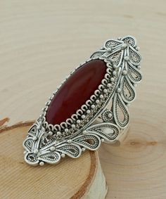 Carnelian Solid 925 Sterling Silver Filigree Oval Elongated Statement Ring Ring Face Length: 1.60 inches Width: 0.70 inches Genuine Natural Carnelian Stone: 8MM x 22MM oval 10 Carat Natural Gemstone Nickel free Comes with a free gift pouch and box Excellent quality, have sold in the USA, Canada, Italy, Germany and the UK, and received hundreds five star reviews. The side has lacey paisley figure that tapers for perfect fit and comfortable wear. This ring will come in a designer pouch, put in gif Ruby Ring Designs, Designer Silver Jewellery, Fine Silver Jewelry, Carnelian Stone, Oval Ring, Sterling Silver Filigree, Pillow Forms, Ring Sizes, Silver Filigree