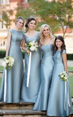 the bridesmaids are all wearing blue dresses