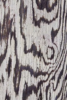 the wood has been painted with black and white designs