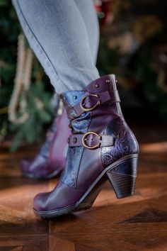 Indulge in luxury with our SOFFIA Floral Embossed Buckle Up Leather Bootie in purple. The intricate floral embossing and chic buckle detail elevate this bootie to a new level of sophistication. Crafted with premium leather, it offers comfort and style for any occasion. Step out in style with SOFFIA. 1.96" heel 5.2" shaft 11.4'' circumference Zip & buckle closure Leather upper Leather lining Leather midsole Leather insole Rubber sole Purple Ankle Heeled Boots For Fall, Fall Purple Ankle Heeled Boots, Fall Purple Leather Heeled Boots, Purple Leather Heeled Boots For Fall, Reindeer Headband, Dress Jewelry, Online Gifts, Leather Booties, Shoe Shop