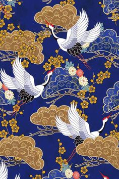 two white birds flying in the sky with clouds and flowers