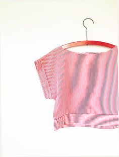 Fab 1990s candy striped Top with back button fastening and a wide boat style neckline. Cropped boxy style with turned up sleeves. Available on layaway, Please DM us for details. Measurements: - 15" Shoulder  - 36" Bust  - 33" Hem circumference - 16.5" Length Description: Vintage Blouse in Excellent Condition. There is no original label but we estimate the material to be cotton. How we measure our garments: * Shoulders - Measured flat between arm hole seams across shoulders * Bust - Measured flat Red Short Sleeve Tops With Vertical Stripes, Red Vertical Stripes Tops For Spring, Red Tops With Vertical Stripes For Spring, Red Vertical Stripes Top For Spring, 1990s Candy, Boat Style, Boat Fashion, Vintage Blouse, Red Candy