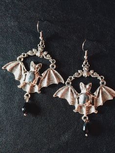 Elvira's Bat Hoop Earrings. Bat Earrings, Silver Earrings, Vintage Bat Jewelry, -Thank you for choosing us. Length - 5 cm. Width - 5 cm. CONDITION: New When placing an order, please write your phone number, this is required by the transport company. Thank you.  ❤︎ Click here to visit my store ❤︎ Dark Beauty:  https://www.etsy.com/shop/DarkBeauty8?ref=seller-platform-mcnav Gothic Nickel-free Hoop Jewelry, Gothic Hoop Earrings For Pierced Ears, Gothic Hoop Earrings For Gift, Gothic Hoop Earrings As A Gift, Vintage Halloween Dangle Jewelry, Gothic Sterling Silver Hoop Earrings, Elegant Nickel-free Halloween Jewelry, Halloween Dangle Pierced Earrings, Gothic Silver Hoop Earrings