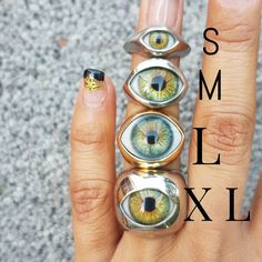 These hand made statement acrylic eye ball beautiful rings are quite an amazing cool gift. This can be your momento mori piece. If you love different unique jewelry, you can choose from any of these four designs!  This listing is for the *HAZEL COLOR* Eyes are probably the most important symbolic sensory organ. Eyes are the symbol of inner awakening, the reminder that beyond a mere organ that helps us navigate the earthly world, they are the door to our interior, the door to that space where our Prosthetic Eye, Whimsical Gothic, Eye Ring Silver, Hazel Color, Momento Mori, Silver Eye, Evil Eye Ring, Jewelry Statement, Eye Ring