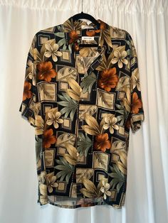 Black & multi-color short sleeve collared Hawaiian print button up shirt with a front breast pocket. Unlined. In excellent vintage condition. DETAILSLabel: Pierre CardinMade in Korea Material: 100% Rayon SIZE & MEASUREMENTSTag Size: Medium Length: 31"Bust: 46"Waist: 44"Sleeve: 10.5"Shoulder: 21.5"Includes Free US Shipping Casual Vacation Shirt With Vintage Print, Casual Retro Print Button-up Shirt, Black Short Sleeve Shirt With Tropical Print, Casual Patterned Collared Short Sleeve Shirt, Casual Vintage Print Shirt For Vacation, Black Tropical Print Short Sleeve Shirt, Retro Floral Print Shirt With Camp Collar, Retro Printed Hawaiian Shirt, Printed Multicolor Collared Short Sleeve Shirt