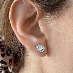 With dazzling cubic zirconia, these halo stud earrings are a must-have accessory. With dazzling cubic zirconia, these halo stud earrings are a must-have accessory.Click on this JEWELRY & WATCHES GUIDE to learn about fit, styles, materials and more! FEATURES Length: 11 mm x 8 mm Backings: post Nickel free Metal: brass Plating: rhodium Finish: polished Packaging: pouchSTONE DETAILS Stone type: cubic zirconia Shape: round, pear Setting: pave Gemstones may have been treated to enhance their appearan Halo Diamond White Earrings In Cubic Zirconia, Diamond White Halo Earrings In Cubic Zirconia, Cubic Zirconia Halo Earrings, Dazzling Cubic Zirconia Diamond Earrings With Halo, Dazzling Cubic Zirconia Halo Diamond Earrings, Dazzling Halo Cubic Zirconia Diamond Earrings, Halo Cubic Zirconia Bridal Earrings As Gift, Bridal Halo Earrings Made Of Cubic Zirconia, Cubic Zirconia Cluster Earrings With Halo Design For Anniversary