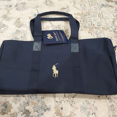 Brand New. Great Size. Has Zipper. Navy Shoulder Bag With Dust Bag For Travel, Blue Duffle Bag With Zipper Closure For On-the-go, Casual Blue Duffle Bag With Zipper, Canvas Duffle Bag, Ralph Lauren Bags, Ralph Lauren Leather, Polo Sport Ralph Lauren, Quilted Totes, Lauren Green