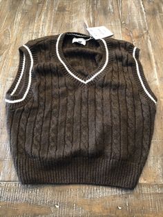 Pull&Bear Brown Knit Vest S. Cozy Warm Brown Top, Preppy Knit Sweater For Fall, Casual Soft Knit Sweater Vest For Winter, Warm Brown Knit Tops, Retro Knitted Brown Tops, Retro Brown Knitted Tops, Brown Knitted Sweater Vest For Winter, Fall Knitted Brown Sweater Vest, Trendy Brown Cable Knit Top