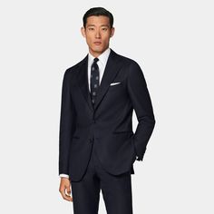 This navy perennial suit pairs a tailored fit jacket with a natural shoulder with slim fit, straight-leg trousers featuring a flat front and belt loops. Navy Lapel Collar Suit For Office, Classic Fitted Pantsuit For Business Meetings, Navy Notch Lapel Suits For Workwear, Slim Fit Suits With Notch Lapel For Business Meetings, Classic Slim Fit Suits For Business Meetings, Slim Fit Notch Lapel Pantsuit For Business, Navy Professional Office Suits, Navy Suits With Welt Pockets And Lapel Collar, Timeless Navy Suits For Work