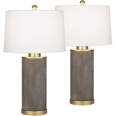 two lamps with white shades on each lamp