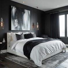 a bedroom with black walls, white bedding and large painting on the wall above it