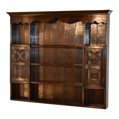 an old wooden bookcase with decorative carvings on it