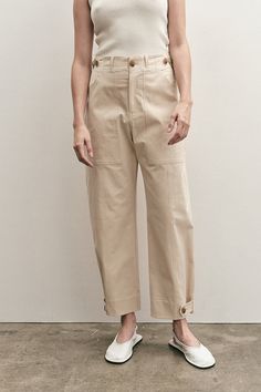 Mijeong Park cropped workwear trousers in light beige. Button and zipper fly front, two front patch pockets, one back patch pocket, adjustable waist and bottom with button and tap.50% cotton, 38% rayon, 7% polyester, 5% polyurethane. Model wears size small. Model is 5’10.” This style runs slightly large. If in between Workwear Style, Workwear Pants, Workwear Trousers, Leather Flip Flops, Secret Sale, Style Pants, Individual Style, Minimal Fashion, Light Beige