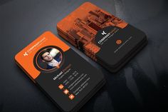 an orange and black business card with a photo on it