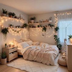 a bedroom with plants and lights on the wall