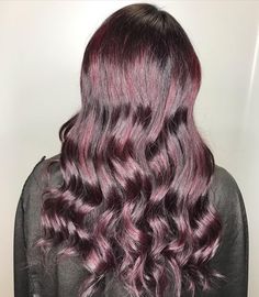 Purple Hair: Black Cherry. Sleek curls in a boysenberry hue. Click through for 25 dark purple hair color ideas. #darkpurplehair #darkpurplehaircolor #purplehair #purplehairideas #haircolorsforbrunettes IG: @hairstylistrosie Shades Of Purple Hair, Sleek Curls